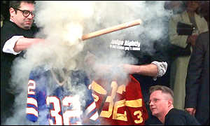 OJ Simpson memorabilia and jerseys being burned